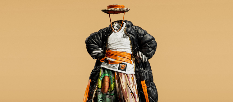 Artistic faceless body in a black coat and colorful clothing.
