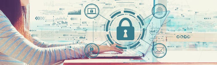 Internet network security concept with woman working on a laptop in brightly lit room.