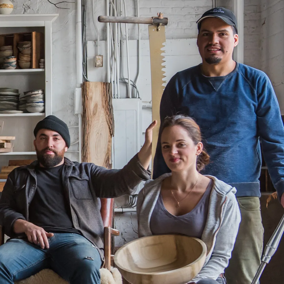Photograph of makers with their wares.