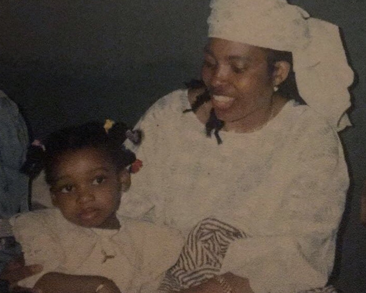 Photograph of young Little Simz in her mothers arms