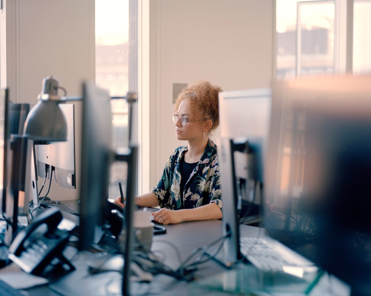 Photograph of Jessica Atkinson at her workstation