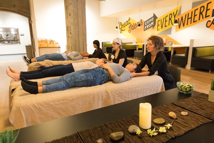 Adobe employees in our San Francisco office back in 2019 getting massages. 