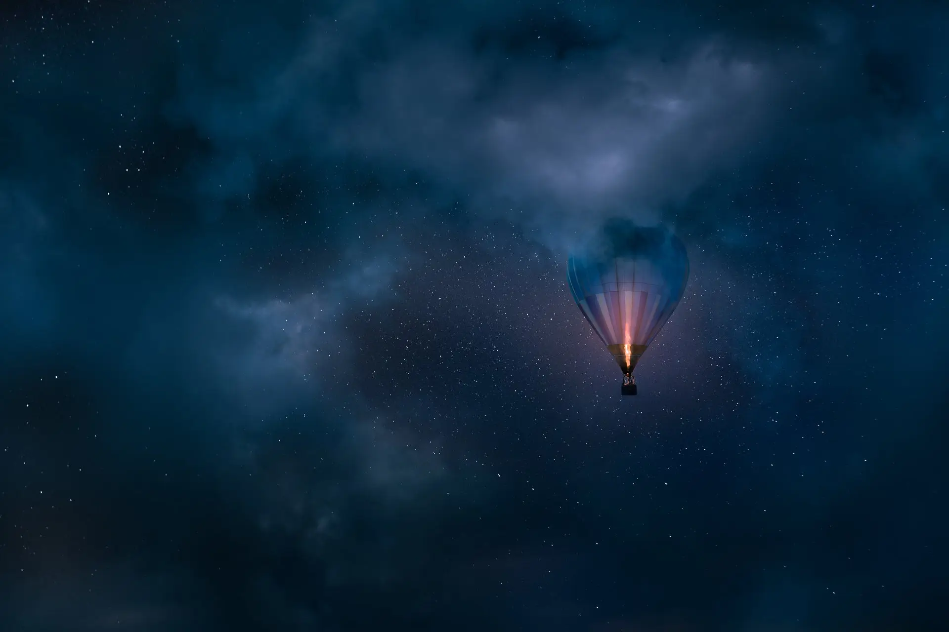 Hot air balloon in the night sky. 