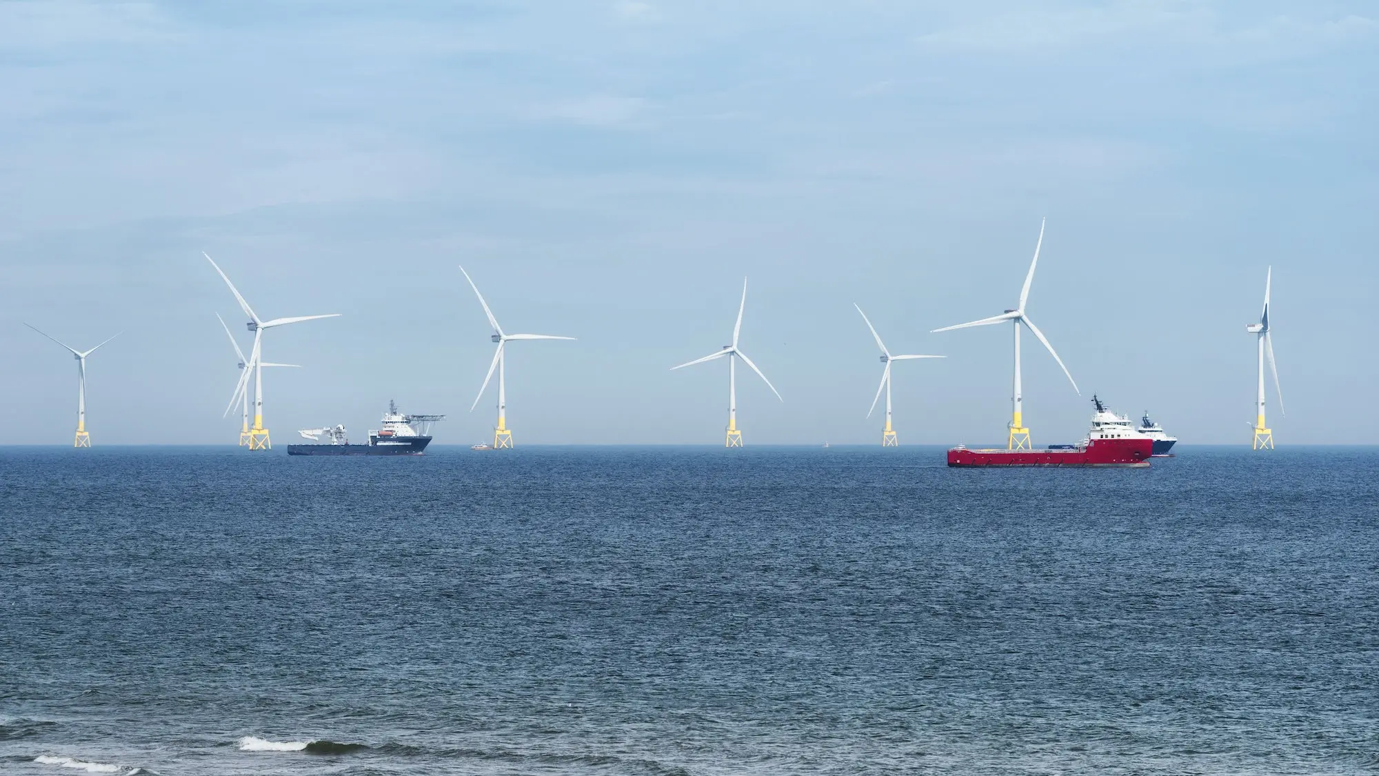 Wind turbines in ocean.
