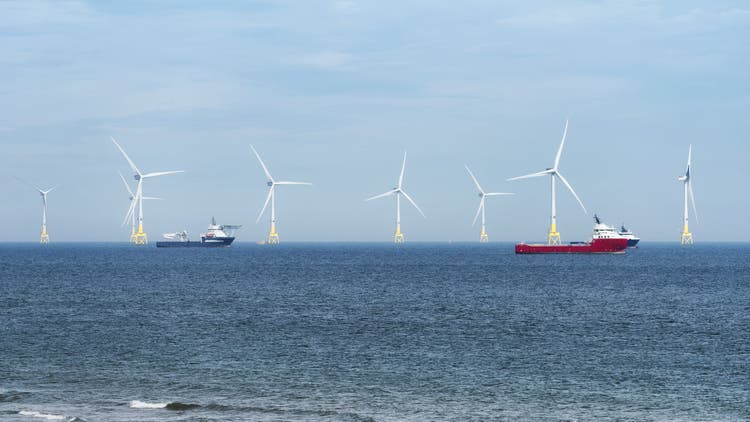 Wind turbines in ocean.