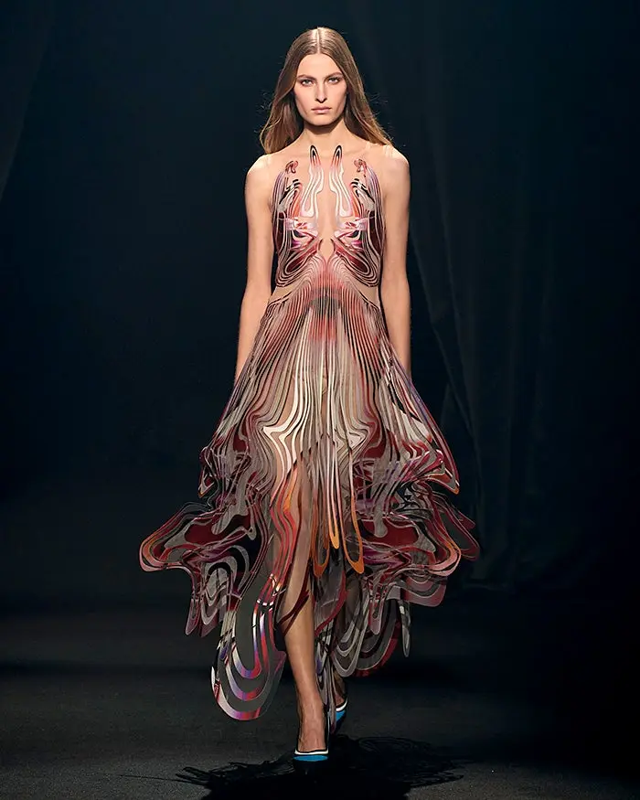 Image of a model in a dress designed by Iris van Herpen in Adobe Creative Cloud.