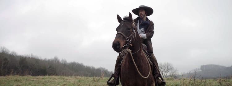 Image of a man on a horse in the film Old Henry.