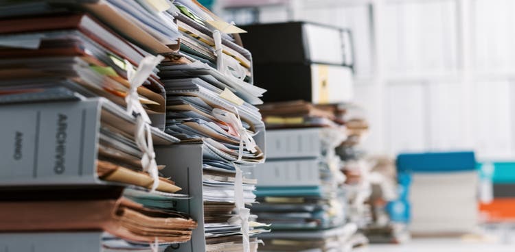 Stacks of paperwork in the office.