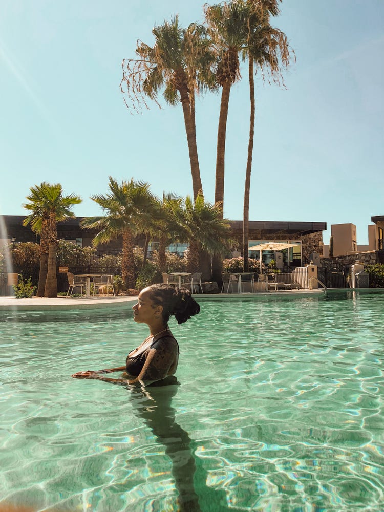 Photograph of Alex Elle in a pool.