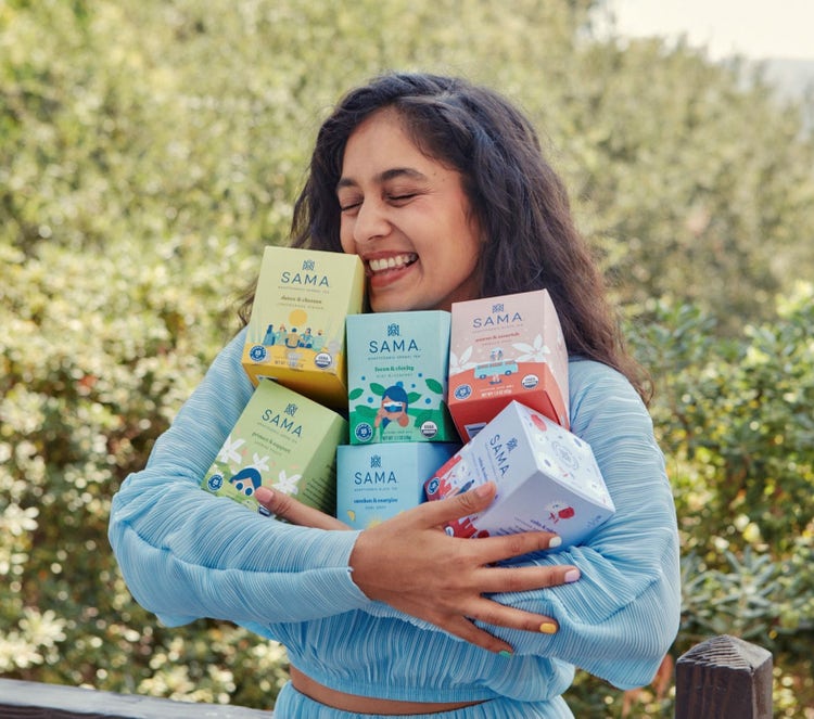 Radhi Devlukia-Shetty holding boxes of her tea, SAMA. 