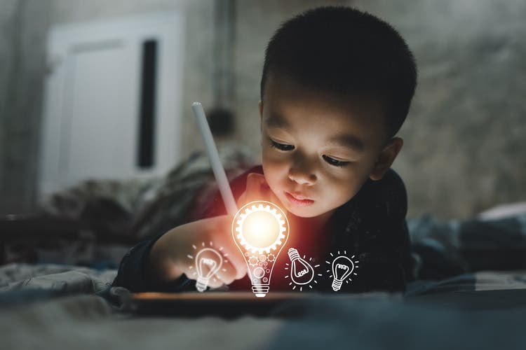 Small child on a tablet.