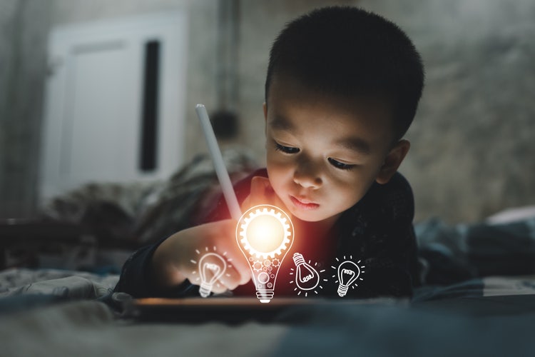 Small child on a tablet.