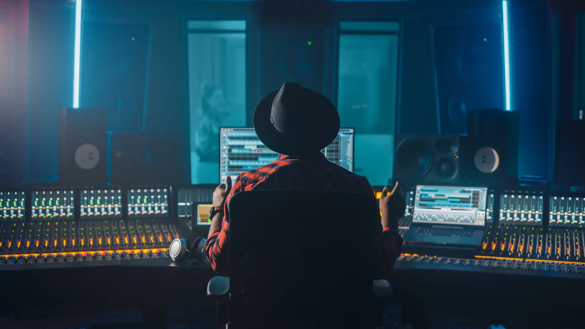 Audio Engineer Uses Control Desk for Recording New Album Track in Music Record Studio.