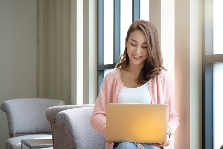 Young woman working business online using laptop.
