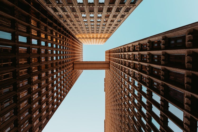 Image of a tall building taken from below.
