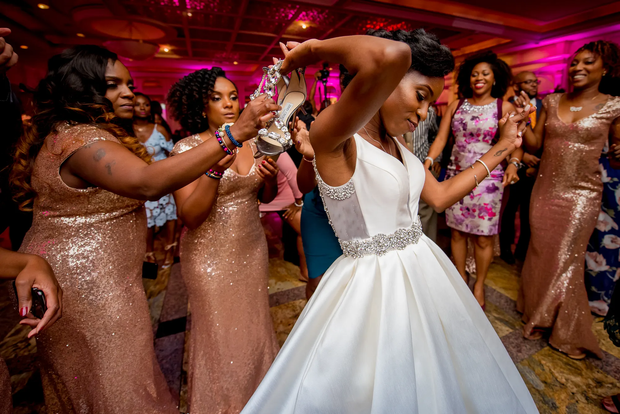 The bride that kicked off her shoes and passed them off to the nearest person so she could dance.