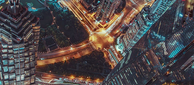 Birds eye view of a busy city street and buildings.