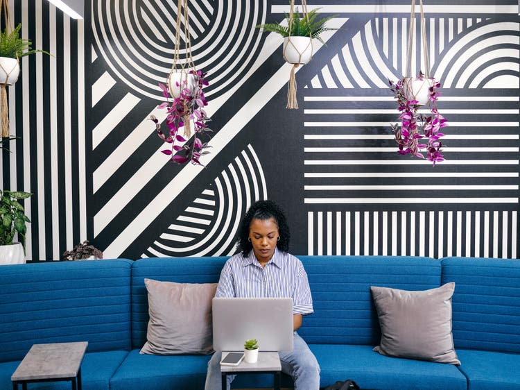 Girl working in a funky office space.