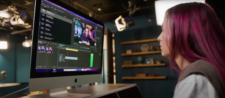 Woman looking at a monitor screen using Adobe Creative Cloud