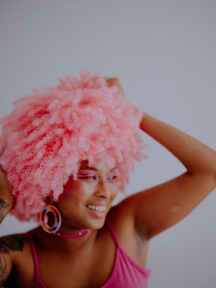 Self portrait of Chinelle Rojas wearing a pink wig, taken with a Fijifilm GFX50S II.