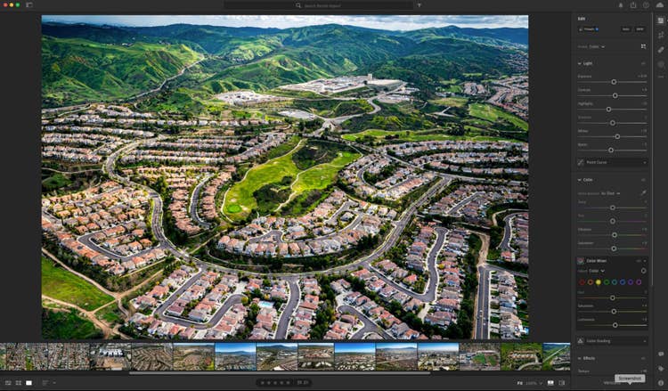 Editing an aerial photograph of a residential neighborhood in Adobe Lightroom.