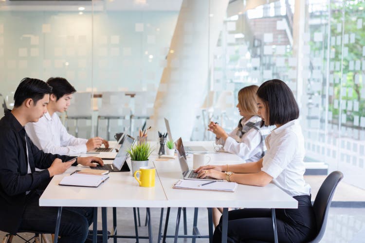 A group of asian diverse university students concentrated on study.