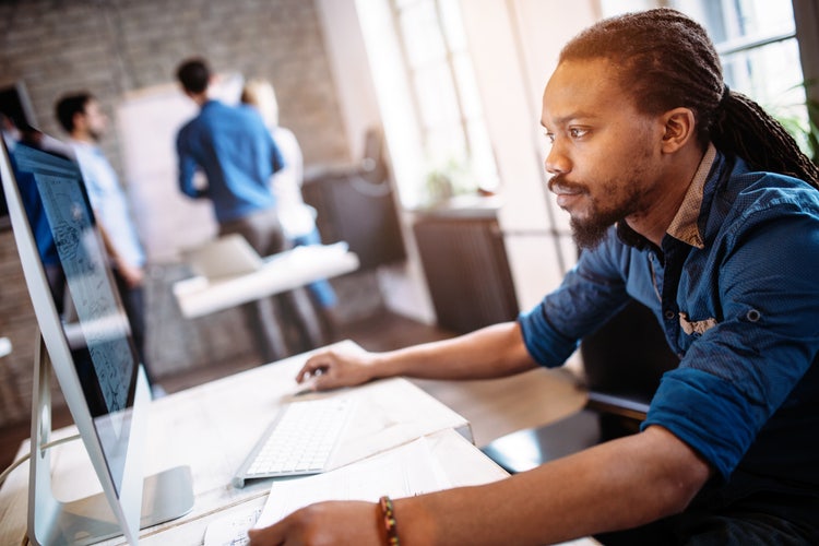 Student athlete looking at a computer.