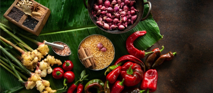 Photo of a pear onion, red chili, ginger, and spices.