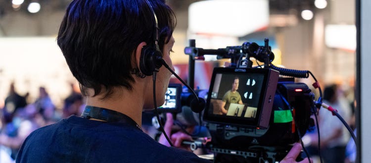 Man holding video equipment.