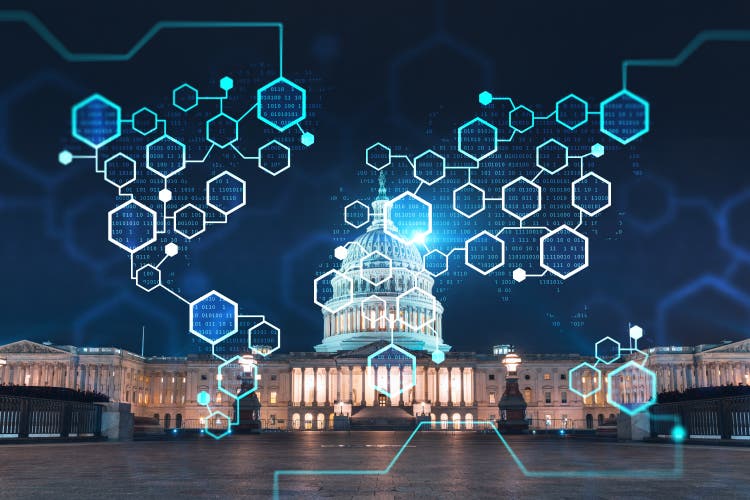 Front view, Capitol dome building at night.