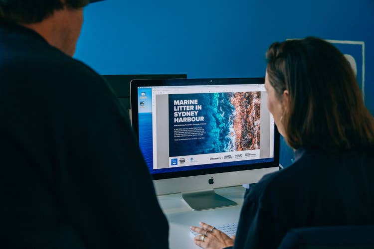 Seabin employees working viewing a PDF