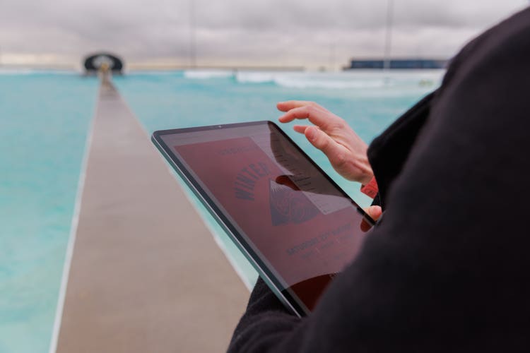 Man editing poster on iPad with Acrobat