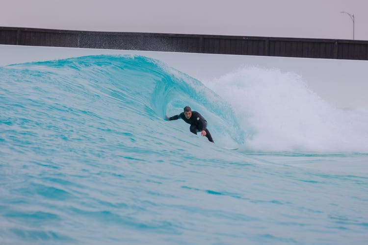 Man surfing barrel of wave