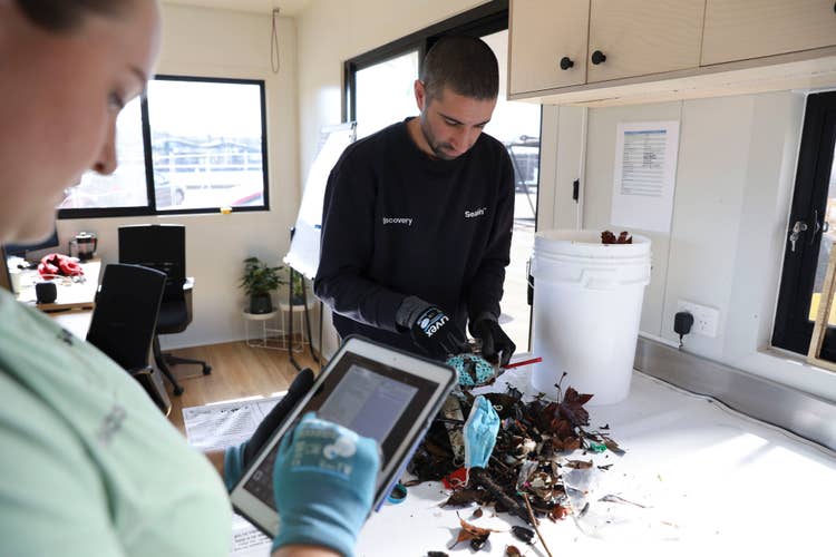 Rubbish from Seabin being sorted and data being captured on iPad