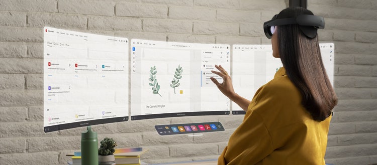 Woman looking at screens with Meta Quest or Quest Pro VR device.