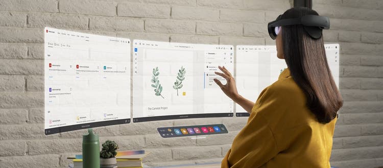 Woman looking at screens with Meta Quest or Quest Pro VR device.