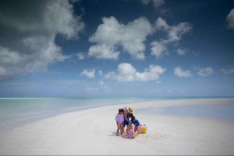 An underexposed family portrait on the beach.