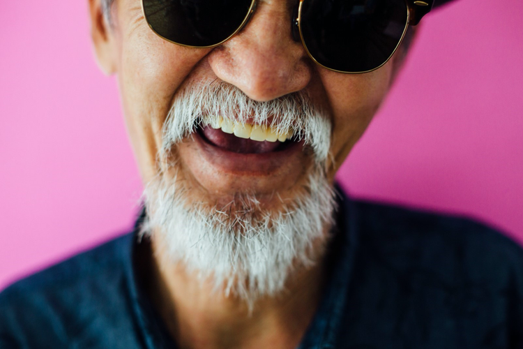 Image of Senior asian man portrait on pink background.