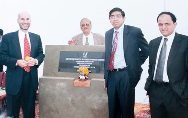 Adobe India founder Naresh Gupta laying the building foundation.