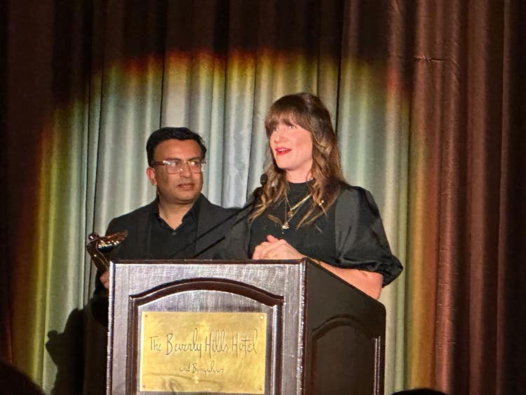 Sriram Iyer and Meagan Keane of Adobe accepting the AIS 2023 Century Award