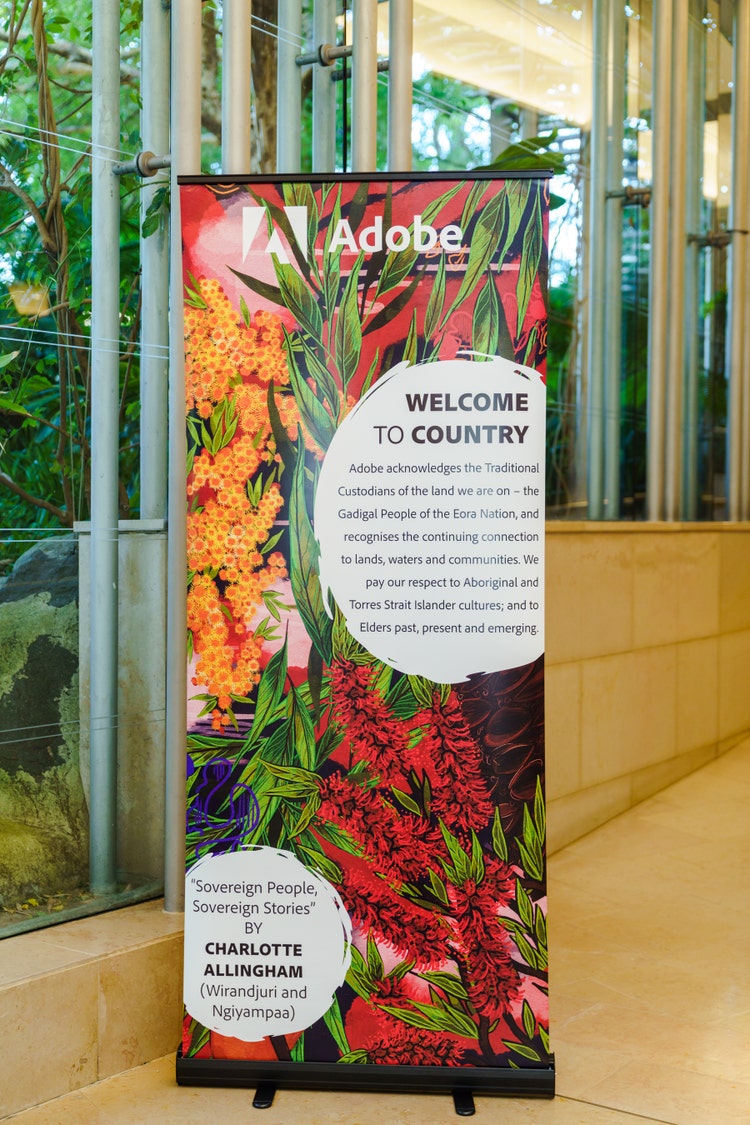 Acknowledgement of Country banner with artwork of Australian native flowers.