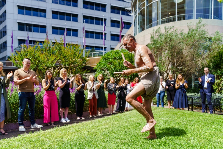 Indigenous man performing ceremony outside