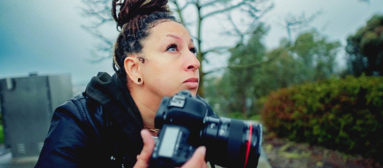 Image of Tara Pixley holding a camera.