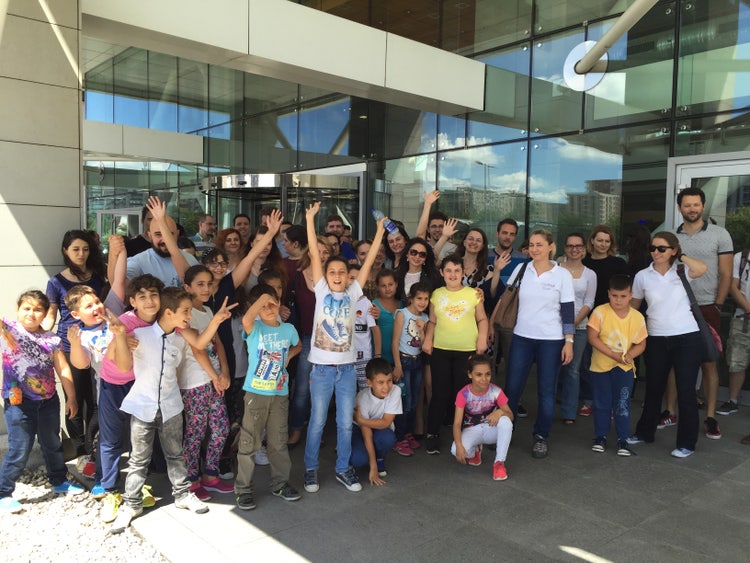 Group of people outside of a building entrance.
