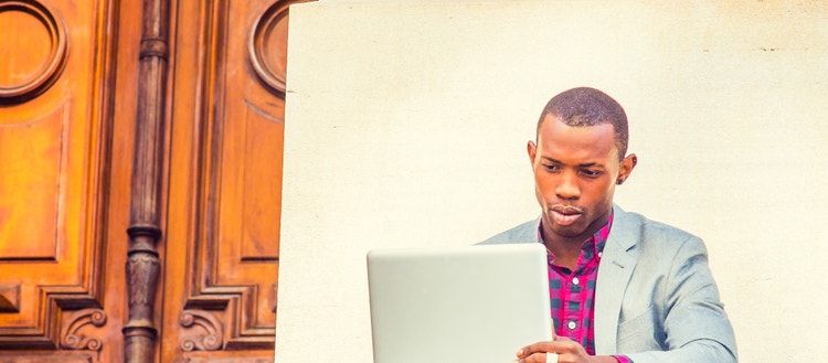 Man looking at a laptop.
