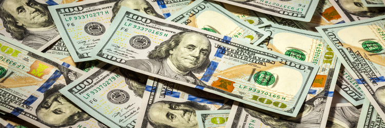 Image of a pile of $100 dollar bills. 