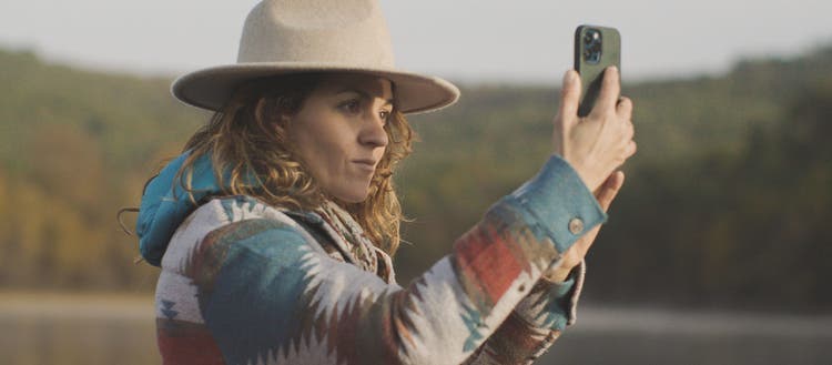 Image of woman looking at phone.