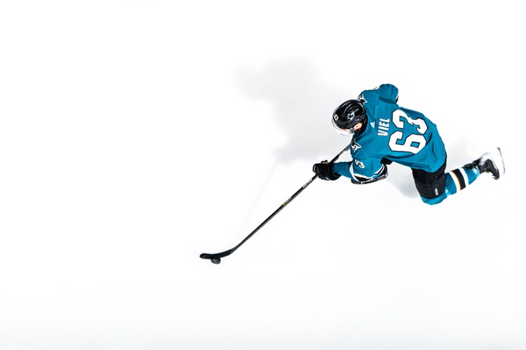 Image of hockey player- Amanda Cain and her diverse photography team behind the San Jose Sharks