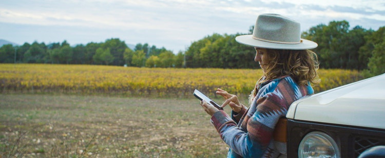 Photograph of woman looking at her phone.