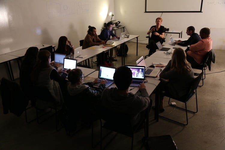 Photograph of Christoph Geiseler talking to a group of people.